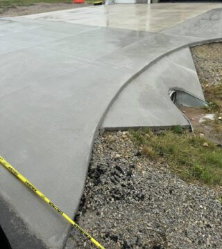 New concrete driveway and curved apron installation